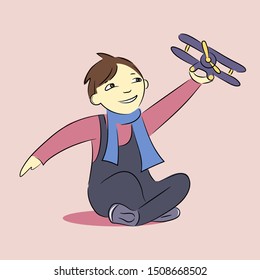 a small dark-haired boy plays with an airplane and smiles happily