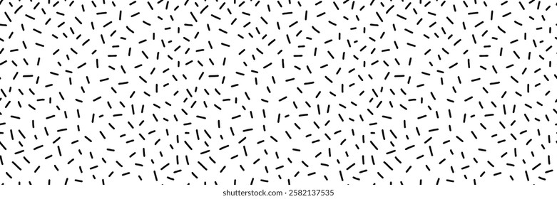 Small dash seamless pattern. Abstract Memphis style background, retro confetti black and white texture, simple geometric shapes, playful design. Perfect for prints, and textiles. Vector illustration