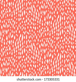 Small ditsy pattern with short hand drawn strokes in coral red color. Seamless texture in hipster style for web, print, fabric, textile, website, invitation card background, summer fall fashion, paper