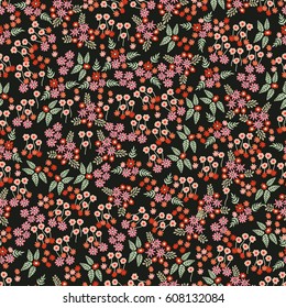 Small flowers blossom. Asymmetric composition with floral elements.