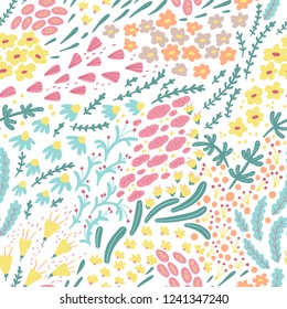 Small flowers seamless vector pattern in pastel colors. Chaotic order. Summer trendy floral background in free hand-drawn style. Good for wallpaper, scrabbooking, textiles, wrapping paper, printing an