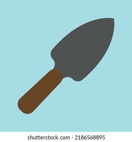 Small Garden Shovel On A Blue Background