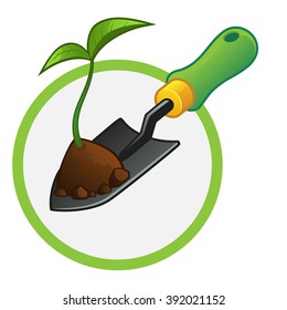 small gardening shovel with a plant and some soil