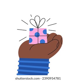A small gift box on a hand. Adorable greeting card.
