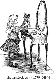 A small girl in her fancy dress standing before the mirror and playing with her kitten. Cat, Felis catus species, a small carnivorous mammal, family Felidae and often referred to as the domestic cat,