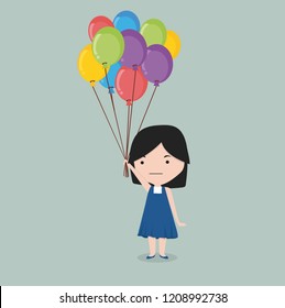 small girl holding balloon