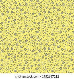 Small gray flower amd leaves on yellow background seamless floral pattern