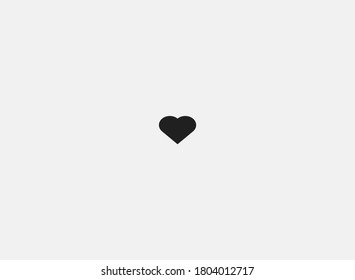 Small heart on a gray background. Minimalism