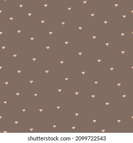 Pequeños corazones sobre un fondo oscuro sin costuras. Pequeños corazoncitos sin costura.
Corazones repetidos dibujados a mano. Patrón perfecto. Impresión romántica infinita. 
