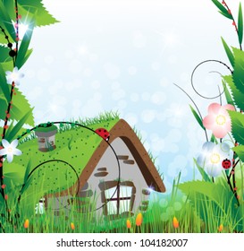 Small  house with a sod roof on a meadow with blooming tulips