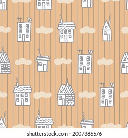Small houses seamless pattern. Lovely hand-drawn houses in doodle style. Pastel palette. Beige background. For the design of children's fabrics, textiles, clothing, wrapping paper, children's room.