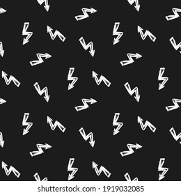 Small ink white lightning bolts isolated on black background. Monochrome seamless pattern. Vector flat graphic hand drawn illustration. Texture.