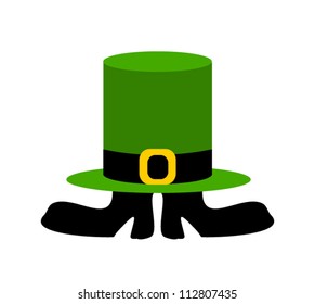 small leprechaun with boots covered by irish hat