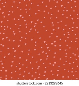 Small little stars background texture vector seamless pattern retro style in red background pink stars. good for fabric wallpaper and any projects.