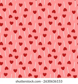 Small lollipops hearts isolated on pink background. Cute seamless pattern. Vector simple flat graphic illustration. Texture.