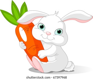 Small lovely rabbit holds giant carrot