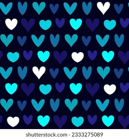 Small multi-colored hearts isolated on a dark blue background. Cute seamless pattern. Vector simple flat graphic illustration. Texture.