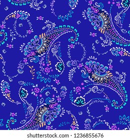 small paisley pattern on blue - seamless background