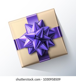 Small paper gift box with big glittering purple bow and ribbons isolated on white background. Top view. Vector realistic festive illustration. Decoration element for holiday design.