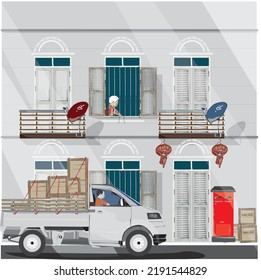 A small pickup truck for delivering goods in the community. residential building