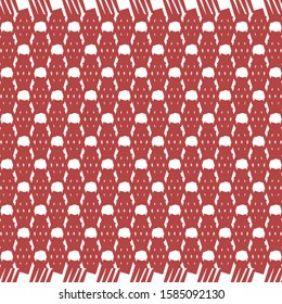 Small red carpet with fringes at the ends. Geometric motif alternating with rhomboid or rounded shapes. Decorative graphics.