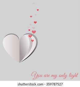 Small red hearts coming out of a folded paper heart shape on gray background for Happy Valentine's Day celebrations. You are my only light text message