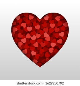 A small red hearts in heart shape frame on white background. Concept of Love and Valentine's Day.