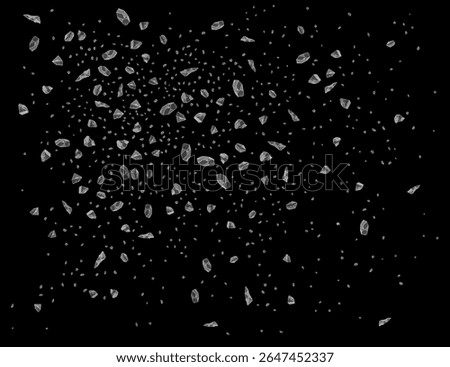 Small salt crystals bursting against a black background, creating a stunning and dynamic pattern. Ideal for use as backgrounds or textures in various design projects