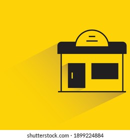 small shop with drop shadow on yellow background