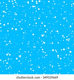 Small snow fallen in front of the blue background.