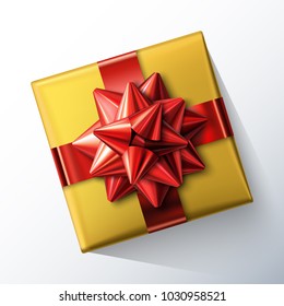 Small square gift box with big glittering red bow and ribbons isolated on white background. Top view. Vector realistic festive illustration. Decoration element for holiday design. 