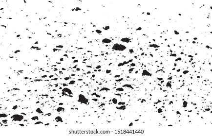 Small uneven spots and particles of debris. Abstract vector texture.  Distressed uneven background. Grunge texture overlay with fine grains isolated on white background. Vector illustration. EPS10.