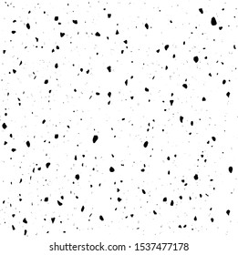 Small uneven spots and particles of debris. Abstract vector texture.  Distressed uneven background. Grunge texture overlay with fine grains isolated on white background. Vector illustration. EPS10.