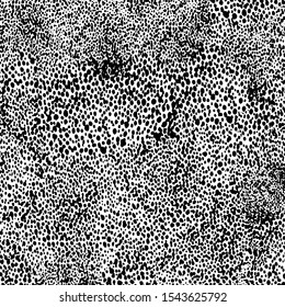 Small uneven spots and particles of debris. Abstract vector texture.  Distressed uneven background. Grunge texture overlay with fine grains isolated on white background. Vector illustration. EPS10.