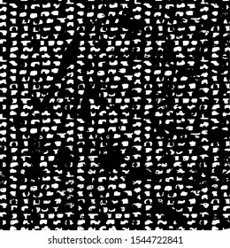 Small uneven spots and particles of debris. Abstract vector texture.  Distressed uneven background. Grunge texture overlay with fine grains isolated on white background. Vector illustration. EPS10.