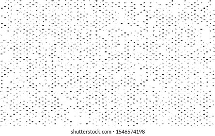 Small uneven spots and particles of debris. Abstract vector texture.  Distressed halftone background. Grunge texture overlay with fine grains isolated on white background. Vector illustration. EPS10.