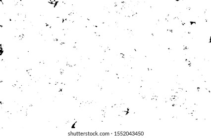 Small uneven spots and particles of debris. Abstract vector texture.  Distressed uneven background. Grunge texture overlay with fine grains isolated on white background. Vector illustration. EPS10.