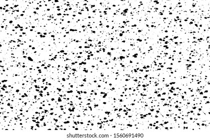 Small uneven spots and particles of debris. Abstract vector texture.  Distressed uneven background. Grunge texture overlay with fine grains isolated on white background. Vector illustration. EPS10.