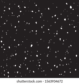 Small uneven spots and particles of debris. Abstract vector texture.  Distressed uneven background. Grunge texture overlay with fine grains isolated on white background. Vector illustration. EPS10.