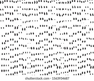 Small uneven spots and particles of debris. Abstract vector texture.  Distressed uneven background. Grunge texture overlay with fine grains isolated on white background. Vector illustration. EPS10.