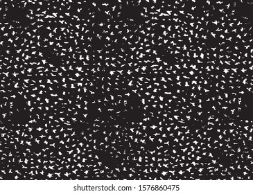 Small uneven spots and particles of debris. Abstract vector texture.  Distressed uneven background. Grunge texture overlay with fine grains isolated on white background. Vector illustration. EPS10.