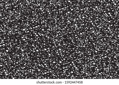 Small uneven spots and particles of debris. Abstract vector texture.  Distressed uneven background. Grunge texture overlay with fine grains isolated on white background. Vector illustration. EPS10.
