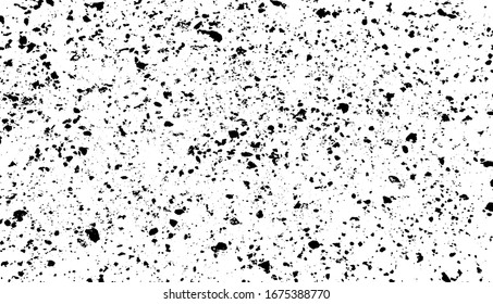 Small uneven spots and particles of debris. Abstract vector texture.  Distressed uneven background. Grunge texture overlay with fine grains isolated on white background. Vector illustration. EPS10.