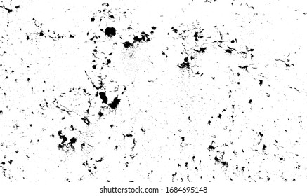 Small uneven spots and particles of debris. Abstract vector texture.  Distressed uneven background. Grunge texture overlay with fine grains isolated on white background. Vector illustration. EPS10.