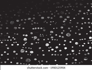 Small uneven spots and particles of debris. Abstract vector texture.  Distressed uneven background. Grunge texture overlay with fine grains isolated on white background. Vector illustration. EPS10.
