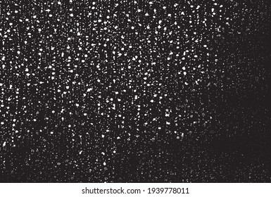 Small uneven spots and particles of debris. Abstract vector texture.  Distressed uneven background. Grunge texture overlay with fine grains isolated on white background. Vector illustration. EPS10.