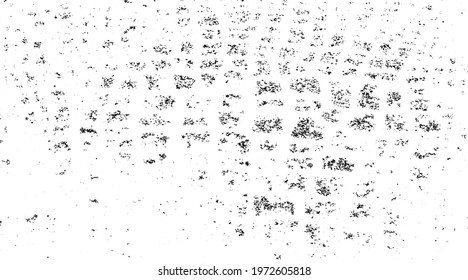 Small uneven spots and particles of debris. Abstract vector texture.  Distressed uneven background. Grunge texture overlay with fine grains isolated on white background. Vector illustration. EPS10.