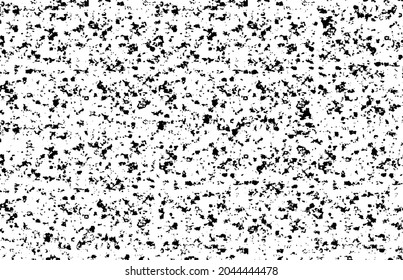Small uneven spots and particles of debris. Abstract vector texture. Distressed uneven background. Grunge texture overlay with fine grains isolated on white background. Vector illustration. EPS10.