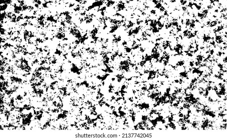 Small uneven spots and particles of debris. Abstract vector texture.  Distressed uneven background. Grunge texture overlay with fine grains isolated on white background. Vector illustration. EPS10.