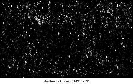 Small uneven spots and particles of debris. Abstract vector texture.  Distressed uneven background. Grunge texture overlay with fine grains isolated on white background. Vector illustration. EPS10.